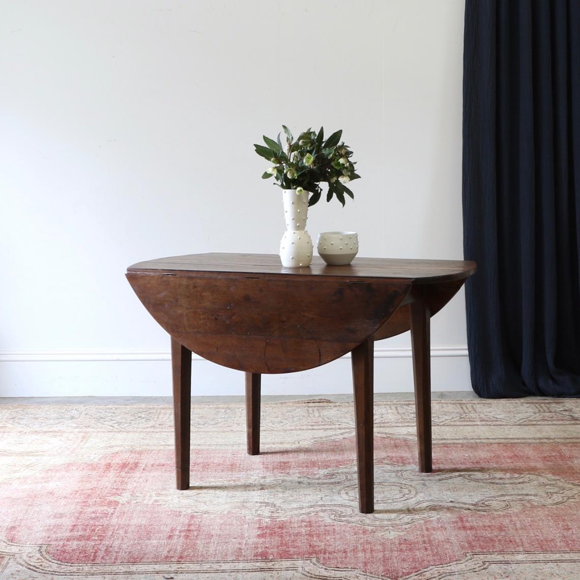 A Round Drop Side Dining Table